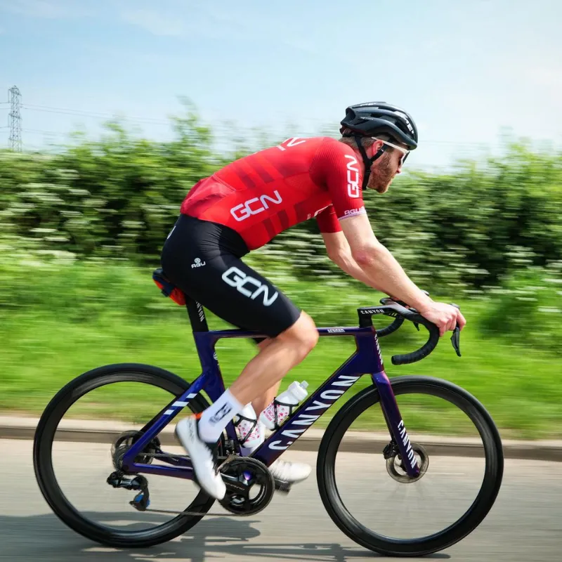 17. Ollie GCN cyclist with a purple Canyon Ultimate CFR Di2 Aero Pro-Level Road Bike with Drive 40D Wheels